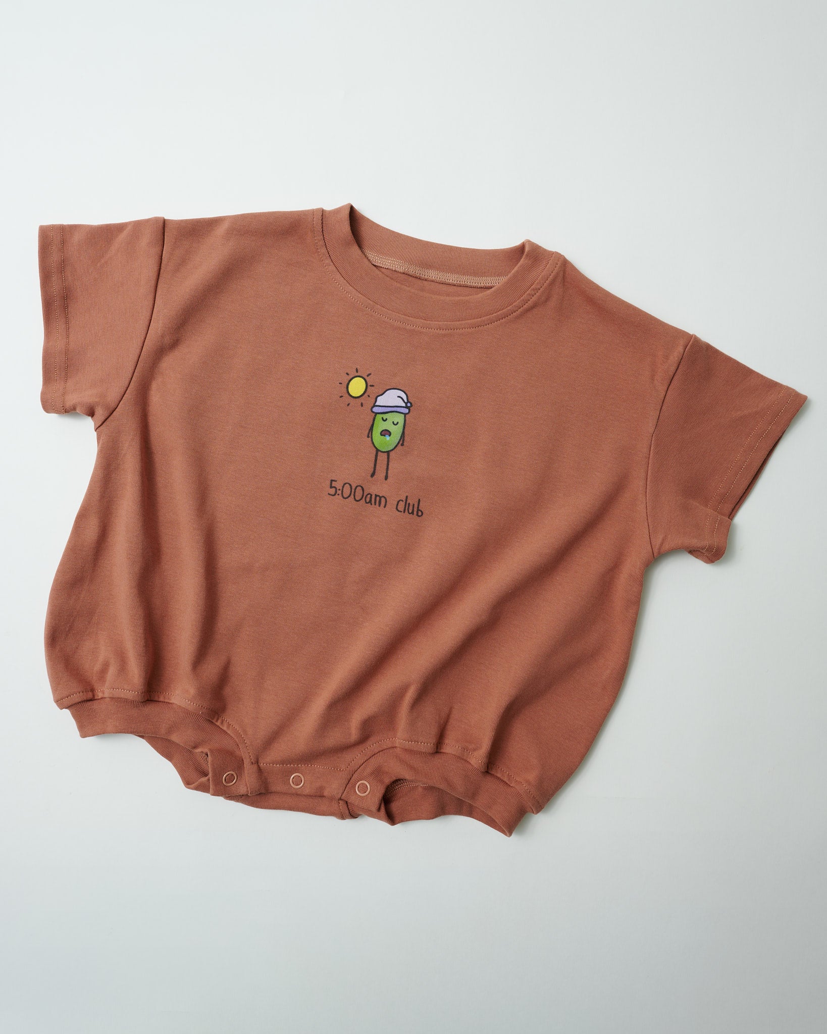 Front view of "5:00am Club" funny baby romper in earthy clay organic cotton.