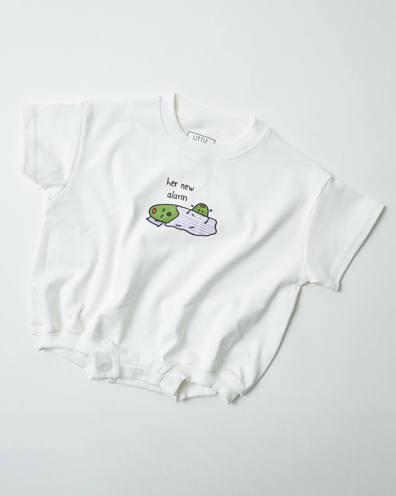 Front view of "Her New Alarm" funny baby romper in snow organic cotton.