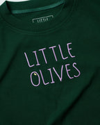 Detailed shot of light purple "LITTLE OLIVES" embroidery on forest green organic cotton.
