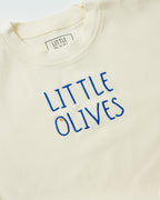 Close-up of navy blue 'Little Olives' embroidery on a natural cream organic cotton baby romper.